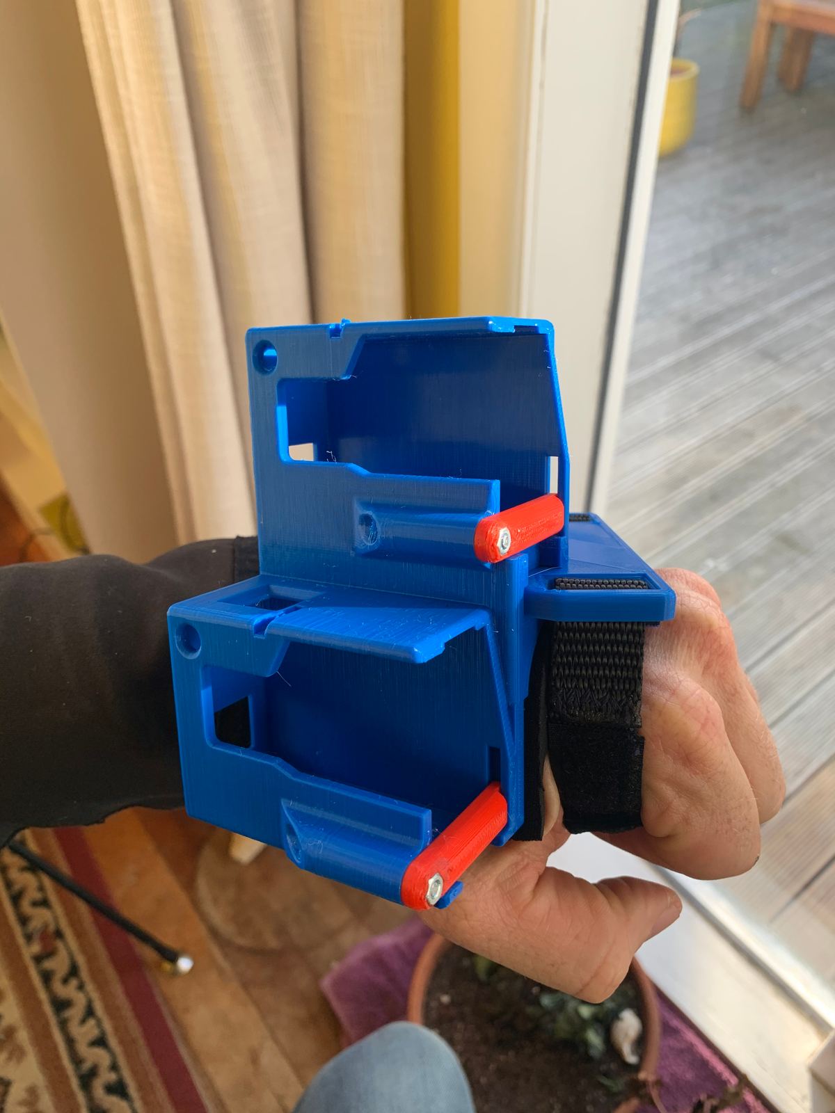 A Wristy Handycam in blue and red
